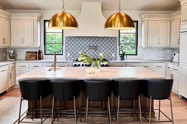 Whole-home remodel in Santaluz - We remodeled much of this Santaluz house as one project: the primary bath, kitchen, wet bar, floors, laundry room, half bath, paint and lighting.
In the kitchen we kept the existing cabinets and painted them, finished the island in its own color, and added new counters, a new backsplash, new hardware and two pendants over the island. Whole-home remodel in Santaluz - We remodeled much of this Santaluz house as one project: the primary bath, kitchen, wet bar, floors, laundry room, half bath, paint and lighting.
In the kitchen we kept the existing cabinets and painted them, finished the island in its own color, and added new counters, a new backsplash, new hardware and two pendants over the island.