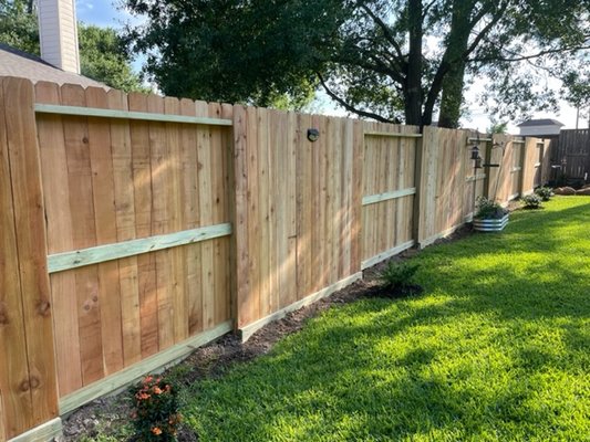 Nail Up Fences in Spring - Privacy Fence For Your YardThe classic “nail up” fence is simple and sturdy. This fence normally consists of non-overlapping, side-by-side boards, but board-on-board styles are also possible. Typically, this style will use “dog-eared” boards or regular flat top boards. It’s a great way to add privacy to your yard, and this style will typically be more affordable than others.