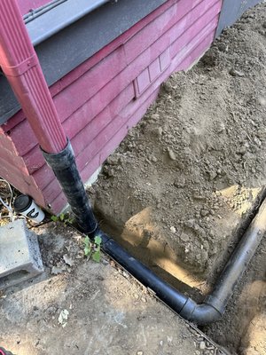 Rain drain system - We installed a rain drain system by trenching from the downspouts to a proper discharge point in the yard. Solid pipes were installed to carry water safely away from the foundation, helping prevent pooling, erosion, and long-term water damage. Rain drain system - We installed a rain drain system by trenching from the downspouts to a proper discharge point in the yard. Solid pipes were installed to carry water safely away from the foundation, helping prevent pooling, erosion, and long-term water damage.