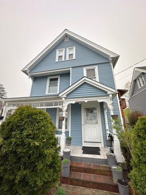 Exterior Portfolio Vinyl Siding Replacement - We were so happy to return to one of our loyal customers this year to complete their siding replacement after we installed a new roof for them last year.
Here’s what we did to give their home a beautiful, fresh new look:

✅ House Wrap Installation: Added high-quality house wrap for improved weather resistance and energy efficiency.
✅ Corner Posts Installation: Installed 3 - 1/2" white vinyl corner posts for a clean, finished appearance and added structural support.
✅ Window & Door Trims: Installed 3-1/4" white G-channels around all windows and doors for a professional finish and proper siding integration.
✅ Soffit Wrapping: Wrapped the soffit with durable materials, enhancing both the look and ventilation.
✅ Starter Strip Installation: Installed an aluminum starter strip for proper alignment and support.
✅ Vinyl Siding Installation: Installed Exterior Portfolio siding in the color Polaris, providing long-term durability and curb appeal.
✅ Accessory Installation: Added finishing touches like water faucet trim, dryer vent covers, and light boxes for exterior fixtures.

We love helping our customers improve their homes, and it’s always a pleasure to work with them again! If you’re thinking of upgrading your siding, we’d love to help.