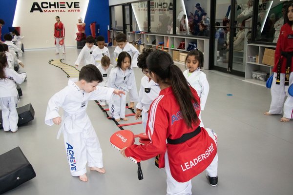 Programs for All Ages - At Achieve Martial Arts, our goal is to help students grow into skilled martial artists while learning the importance of self-defense and fitness. We go beyond physical training by teaching how to connect mind and body, embracing martial arts as a lifestyle. Through this journey, students build respect, confidence, and strength to become positive members of the community. Programs for All Ages - At Achieve Martial Arts, our goal is to help students grow into skilled martial artists while learning the importance of self-defense and fitness. We go beyond physical training by teaching how to connect mind and body, embracing martial arts as a lifestyle. Through this journey, students build respect, confidence, and strength to become positive members of the community.