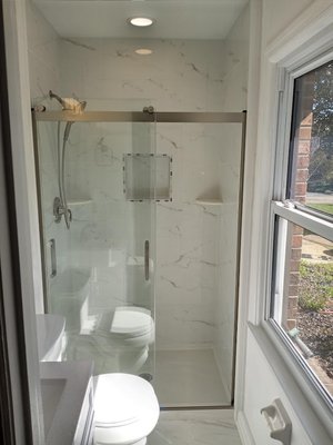 Reid & Beth - Bathroom updated tile walls and floor new fixtures.
