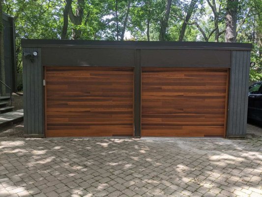 Garage Door Install - Planks Doors - Old and worn out garage doors were in need of replacement. Changing the doors to a more modern style changed the appearance of the property entirely. Garage Door Install - Planks Doors - Old and worn out garage doors were in need of replacement. Changing the doors to a more modern style changed the appearance of the property entirely.