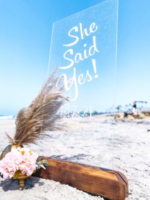 Engagement Picnic Reception - The groom wanted to propose in his home town on the beach, and wanted his friends and family there as a surprise right after she said yes. This was a small informal surprise reception for 20 people. He wanted a few light bites and cups for a champagne toast, since they were planning to eat at a restaurant afterwards. He also wanted a neutral and pale pink color scheme with a backdrop and signage for photo ops. Engagement Picnic Reception - The groom wanted to propose in his home town on the beach, and wanted his friends and family there as a surprise right after she said yes. This was a small informal surprise reception for 20 people. He wanted a few light bites and cups for a champagne toast, since they were planning to eat at a restaurant afterwards. He also wanted a neutral and pale pink color scheme with a backdrop and signage for photo ops.