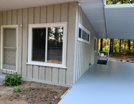 Exterior Spray Painting - Our professional exterior spray painting services revived the curb side appeal for our client with a fresh coat of paint transforming the facade of this home.