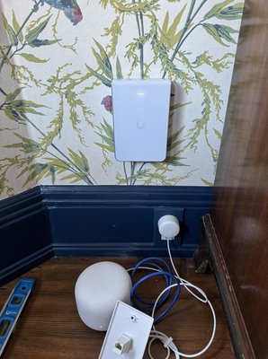 4-Story Victorian Home Ethernet & Wi-Fi Install - We hardwired 4 Story Victorian House and installed Ubiquiti access points on each floor for fast and reliable coverage throughout the house. Old Google Nest units were removed and replaced with clean, wall-mounted APs. All networking equipment such as router, switch, and modem was relocated to the garage and professionally mounted.

Now, any internet provider can easily connect from the garage, giving the client full flexibility to choose or switch providers in the future.