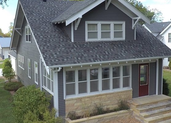 2021 Home Color Options: Is Gray the Right Color for Your Siding? - Choosing a siding color can be a mixed bag for many homeowners. What should be the most fun and exciting part of siding replacement can easily transform into a complex case of choice overload. There are countless siding color combinations and options to choose between, and homeowners usually don’t know where to start. We want to make this process a bit less daunting, as choosing your home’s color palette should be enjoyable and exciting. You are able to renew (or completely reinvent) the look of your home. 

Here’s a Bit of Inspiration
Each year, Pantone® chooses a “Color of the Year.” This is based on recent trends inspired by “the entertainment industry and films in production, traveling art collections and new artists, fashion, all areas of design, popular travel destinations, as well as new lifestyles, playstyles, and socio-economic conditions.” 

This year, they chose two colors: Ultimate Gray (17-5104) and Illuminating (13-0647). They chose these colors because they represent a “story of color that encapsulates deeper feelings of thoughtfulness with the promise of something sunny and friendly.”  

In previous years, the Pantone Color of the Year was Coastal Blue and Ultra Violet, and Greenery.  

Gray has been on the rise in both interior and exterior design, but it’s interesting to see that Illuminating (a light yellowish shade) is making a comeback. It’s generally reserved as an accent color, but seeing it take center stage is certainly an unexpected trend going into 2021. 

Will These Colors Work for Your Siding?
Gray is a great neutral color for siding, and although it may seem bland, it can really make a statement when used correctly. Shades of gray can certainly make your home stand out in your neighborhood. 

Case Study: Schmidt Roofing made gray roofing and siding work for this home! See the results! 

While yellow may not be catching on in terms of siding colors, it still works as a great accent for gray siding and roofing. We recommend trying it for things like shutters, garage doors, entry doors, and other accented areas on your home. 

 

Need help choosing a color for your home’s siding or roof? Let us be your guide! Get in touch with Schmidt Roofing for a free quote and color consultation.