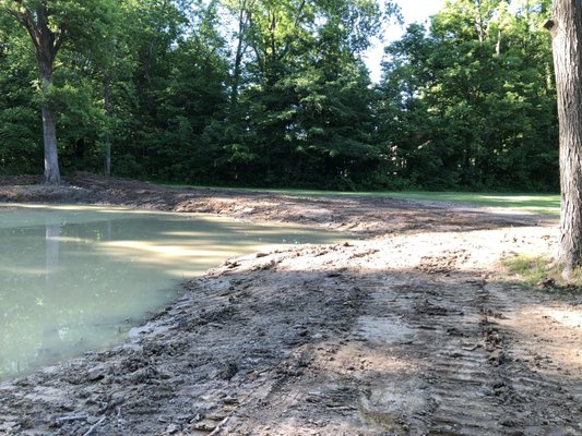 Grading & Drainage - This is a large pond that we build for drainage control. Grading & Drainage - This is a large pond that we build for drainage control.