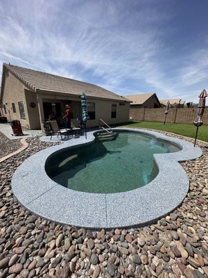 Pool Deck in Nautical Flake - We completed this project of a pool deck done in Nautical blue flake.
We took the existing cool decking of using diamond but grinders. We then mended much of the area that had cracks or chunks of concrete missing.
We applied a base coat of polyaspartic for its UV stable characteristics then added a full broadcast of flake.
We then let it dry and scraped and vacuumed the excess flake. After that we applied our top coat of polyaspartic and cleaned up all of the area surrounding Pool Deck in Nautical Flake - We completed this project of a pool deck done in Nautical blue flake.
We took the existing cool decking of using diamond but grinders. We then mended much of the area that had cracks or chunks of concrete missing.
We applied a base coat of polyaspartic for its UV stable characteristics then added a full broadcast of flake.
We then let it dry and scraped and vacuumed the excess flake. After that we applied our top coat of polyaspartic and cleaned up all of the area surrounding