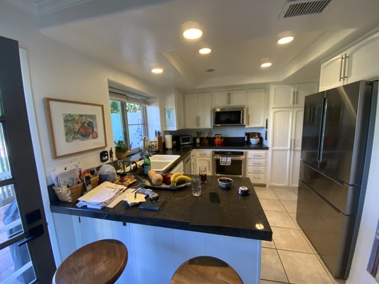 “ I want a new White Kitchen”… - This beautiful kitchen project was full of surprises…
When you about to remodel a kitchen that have a lower ceiling (soffit) it is always 50%/50% that either you will run into a nightmare or there is nothing there…
Guess what we run into in this kitchen…
All the plumbing pipe and the drain pipe from the second floor master bathroom were in that soffit, also the some electrical lines…
After consulting with my  plumber and electrician- we come up with a plan and we were able to re configure and reroute the plumbing pipes and electrical wires. We relocate all the original outlets to be hidden just below the  upper cabinets for a totally clean look of the backsplash
The new kitchen was designed with custom cabinets and quartzite slabs. For the backsplash we used very big pieces of an amazing tile to avoid those grout lines… 
The kitchen turned out amazing, we utilized every cabinets and every corner…
And most important- the client was very happy!!!