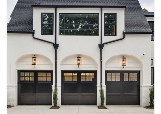 Custom garage doors and repair services - These custom carriage style garage doors were painted black by the homeowner for a dazzling look. Custom garage doors and repair services - These custom carriage style garage doors were painted black by the homeowner for a dazzling look.