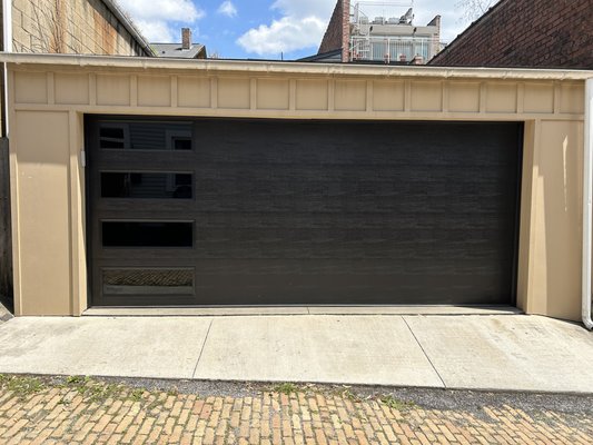 New Black Residential Garage Door - The customer wanted a modern looking sleek door for their house in the Mexican War Streets. This black Amarr Door with side windows looks fantastic with the style of the house. New Black Residential Garage Door - The customer wanted a modern looking sleek door for their house in the Mexican War Streets. This black Amarr Door with side windows looks fantastic with the style of the house.