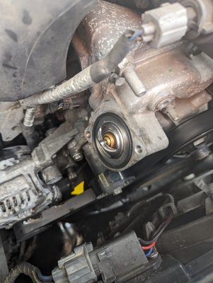 Thermostat replacement - The old thermostat was stuck shut not allowing coolant to enter the engine. A new one with gasket was replaced and now operates at normal operating temperature. Thermostat replacement - The old thermostat was stuck shut not allowing coolant to enter the engine. A new one with gasket was replaced and now operates at normal operating temperature.