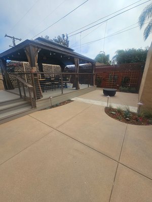 Point Loma Project - Completely Remodeled backyard with topcast colored concrete, custom Deck, custom railing, patio cover, decorative panels, planting, Irrigation, and drainage. Point Loma Project - Completely Remodeled backyard with topcast colored concrete, custom Deck, custom railing, patio cover, decorative panels, planting, Irrigation, and drainage.