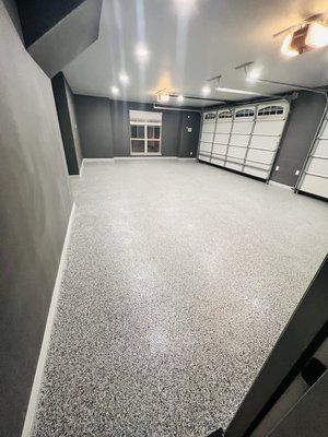 Polyaspartic Garage Floor - This customer wanted to completely update their old 3-car garage. We repaired all cracks, painted the walls and ceiling, and coated the garage floor using a Polyaspartic full flake coating that lasts a lifetime. When completed the customer was extremely excited that their garage turned out so beautiful! Polyaspartic Garage Floor - This customer wanted to completely update their old 3-car garage. We repaired all cracks, painted the walls and ceiling, and coated the garage floor using a Polyaspartic full flake coating that lasts a lifetime. When completed the customer was extremely excited that their garage turned out so beautiful!