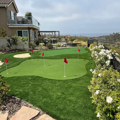 Outdoor Games - Backyard putting greens bocce ball courts and more are a great way to get the family outside and spending time together. Our durable and beautiful artificial turf comes in a variety of textures, lengths and densities so you can mimic the green on your favorite course. Please give us a call and we can help you realize your ideal outdoor gaming space! Outdoor Games - Backyard putting greens bocce ball courts and more are a great way to get the family outside and spending time together. Our durable and beautiful artificial turf comes in a variety of textures, lengths and densities so you can mimic the green on your favorite course. Please give us a call and we can help you realize your ideal outdoor gaming space!