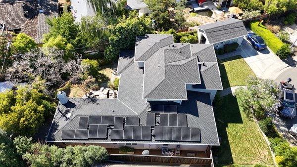 Roof Replacement with Architectural-Style Shingles by ELM in Walnut Creek, CA - ELM completed a residential roof replacement in Walnut Creek, CA, covering the main home and detached garage. We began with the existing roofing in place across multiple upper and lower roof sections, including areas with solar panels. Our crew worked section by section to remove the old roof covering and prepare the property for a complete new roofing system.
During the replacement, our crew completed the tear-off and exposed the wood roof decking so each roof section could be prepared for the next layers. We installed CertainTeed DiamondDeck synthetic underlayment over the prepared decking before installing the new shingles. This underlayment serves as a protective layer between the roof deck and shingles and is an important part of the overall roofing assembly. We then continued the shingle installation across the different roof planes, working around hips, ridges, valleys, the chimney, vents, and other roof penetrations while coordinating the areas used by the solar panels.
By the end of the project, we had replaced the roofing across the residence and detached garage, taking the property through tear-off, roof deck preparation, underlayment, and new shingle installation. The solar panels were returned to the applicable roof sections, completing the roof replacement across the full scope of the property.
Contact ELM to replace your existing roof with a complete roofing system that addresses the layers beneath the shingles as well as the finished roof above. Roof Replacement with Architectural-Style Shingles by ELM in Walnut Creek, CA - ELM completed a residential roof replacement in Walnut Creek, CA, covering the main home and detached garage. We began with the existing roofing in place across multiple upper and lower roof sections, including areas with solar panels. Our crew worked section by section to remove the old roof covering and prepare the property for a complete new roofing system.
During the replacement, our crew completed the tear-off and exposed the wood roof decking so each roof section could be prepared for the next layers. We installed CertainTeed DiamondDeck synthetic underlayment over the prepared decking before installing the new shingles. This underlayment serves as a protective layer between the roof deck and shingles and is an important part of the overall roofing assembly. We then continued the shingle installation across the different roof planes, working around hips, ridges, valleys, the chimney, vents, and other roof penetrations while coordinating the areas used by the solar panels.
By the end of the project, we had replaced the roofing across the residence and detached garage, taking the property through tear-off, roof deck preparation, underlayment, and new shingle installation. The solar panels were returned to the applicable roof sections, completing the roof replacement across the full scope of the property.
Contact ELM to replace your existing roof with a complete roofing system that addresses the layers beneath the shingles as well as the finished roof above.