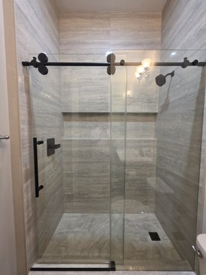 Two Bathroom Tub-to-Shower Conversions - This project included two bathroom tub-to-shower conversions, transforming both spaces into modern, functional bathrooms. Each remodel featured custom showers finished with large-format tile, updated fixtures, and carefully selected finishes and design details. Two Bathroom Tub-to-Shower Conversions - This project included two bathroom tub-to-shower conversions, transforming both spaces into modern, functional bathrooms. Each remodel featured custom showers finished with large-format tile, updated fixtures, and carefully selected finishes and design details.