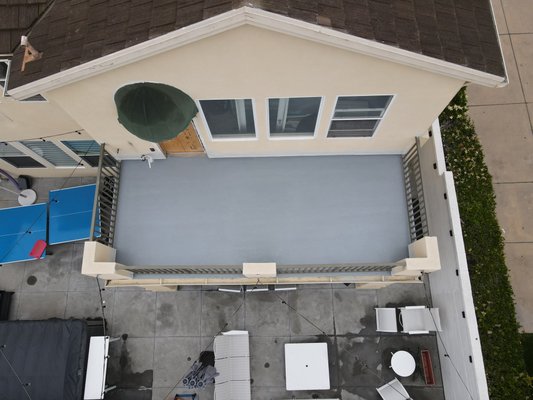 Huntington Deck project - This existing deck was removed down to the existing plywood. We Repaired wood as needed and installed an acrylic based Decking system.