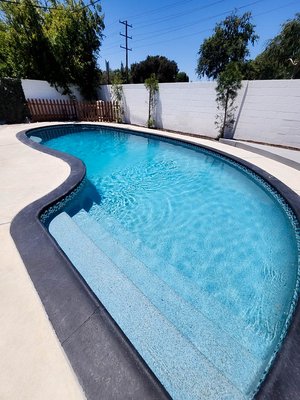 Pool Remodel - From elegant finishes to custom features, we craft pools that elevate your lifestyle and bring vacation vibes home. Like this customer who received upgraded Aqua Blue Mini-Pebble. Pool Remodel - From elegant finishes to custom features, we craft pools that elevate your lifestyle and bring vacation vibes home. Like this customer who received upgraded Aqua Blue Mini-Pebble.