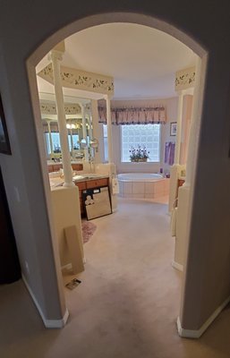 Bathroom Remodel - This is a bathroom remodel where I completely demoed the flooring, tile, cabinets and counter tops. I installed the new cabinets, new baseboards, crown molding, tub surround, half wall top caps, and trimmed out the arched opening. The tile work and quartzite counter tops were completed by another company. Bathroom Remodel - This is a bathroom remodel where I completely demoed the flooring, tile, cabinets and counter tops. I installed the new cabinets, new baseboards, crown molding, tub surround, half wall top caps, and trimmed out the arched opening. The tile work and quartzite counter tops were completed by another company.