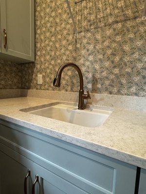Quartz Laundry 2025 - This laundry room in the Mandarin area of Jacksonville, Florida features 3cm Viatera Quartz in the color, "Cirrus".