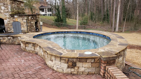 Pool Renovation - Mr. Bean contacted us for his pool renovation job. He wanted to add a very spacious Spa with 6 jets. The Tile he choose blends perfectly with the pebble tech. We didn't change any of his existing patio deck but the stack stone still goes very well with it. One less cost for him of course. No need to spend the money when you have a perfectly good patio that just needs a good cleaning. Georgia Poolscapes always makes affordable options for our customer.