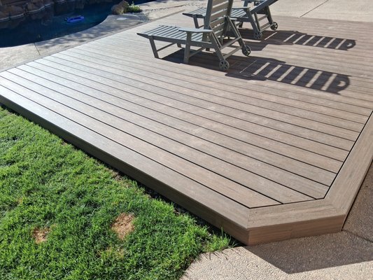 Trex Floating deck - Client states there was to much grass and wanted a bbq space next to his pool. Trex Floating Deck.