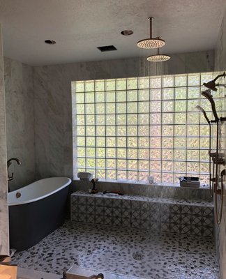 Bathroom remodel - Right Choice Plumbing remodeled this customer's master bathroom to make a giant walk in shower with his and her shower valves, handhelds, and dual rain heads. The freestanding tub is located in the shower! Bathroom remodel - Right Choice Plumbing remodeled this customer's master bathroom to make a giant walk in shower with his and her shower valves, handhelds, and dual rain heads. The freestanding tub is located in the shower!