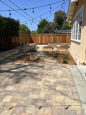 Backyard Installation with Pavers, Stepping Stones, and Garden Beds - Backyard renovation made with pavers, stepping stones, garden beds, and floating bench. Backyard Installation with Pavers, Stepping Stones, and Garden Beds - Backyard renovation made with pavers, stepping stones, garden beds, and floating bench.