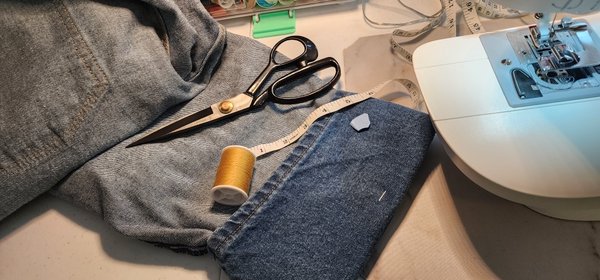 Hemming Jeans, my way. - A customer wanted 3 pairs of men's Jeans hemmed.  It took me 1 & a half days to complete this.  I recommend using denim sewing machine needles as material is thick. Especially when the hem is being folded over a thick seam. I still broke a needle! I hand turn the machine wheel over them as I have more control over the needle, not hitting the pressure plate.  Using some sort of material markers or chalj helps keep your measurements on track for cutting & sewing. My customer was very happy with the results. If you need anything hemmed,  contact me. I will get done fast!