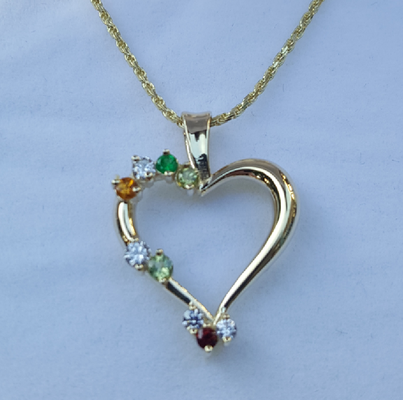 Mom's Love an Item of Jewelry With the Birthstones of the Children - Mother's Day is the Perfect Time to Give a Jewelry Item With the Birthstones of the Children.
Mother's jewelry is cherished by the ladies just as an engagement ring is.
Choose the perfect layout.
You can include just the children or have mom and the children or mom & dad and the children.
How about for Grandmother and all the children and grand children or just the grandchildren?
There are many, many designs of rings and pendants and even bracelets to choose from. Below are a few we've done for customers.