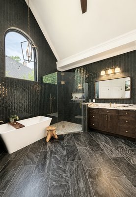 Bathroom Remodel - We recently completed a luxury master bathroom remodel in DFW, transforming the space into a modern, spa-inspired retreat with custom craftsmanship and premium finishes. This full renovation included a custom walk-in shower with a Schluter waterproofing system, large-format tile, shampoo niche,  and a frameless glass door.

Additional work included new floor and wall tile and professional painting throughout. We also installed custom hardwood cabinetry with shaker-style doors and soft-close hardware, along with a quartz vanity countertop, dual sinks, and new mirrors.

This project highlights our expertise in bathroom remodeling in Dallas–Fort Worth and Collin County, including custom showers, tile work, quartz countertops, cabinetry, and full master bathroom renovations.