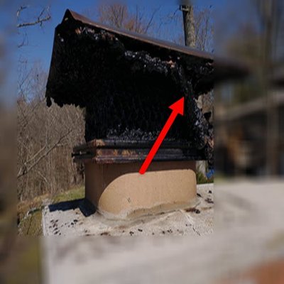 Fireplace would not "draw" smoke - This chimney was dangerously impacted by build up from years of burning wood.  It was not "drawing" the smoke out of the house.  We wondered why...  This was very close to causing a major issue for the home owner.