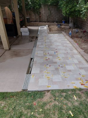 Patio - It was a big patio. The main difficulty in performing the work is the observance of the geometry of laying tiles at a great distance. Since the minimum deviation at the start can lead to a large deviation at the finish and spoil the whole work. Therefore, I used a professional laser level from Bosch. I made a lot of marks, after which I laid the tiles according to the marks. There was also a problem with the observance of the slope for the water to drain to the drain. All tasks were completed. The client was satisfied Patio - It was a big patio. The main difficulty in performing the work is the observance of the geometry of laying tiles at a great distance. Since the minimum deviation at the start can lead to a large deviation at the finish and spoil the whole work. Therefore, I used a professional laser level from Bosch. I made a lot of marks, after which I laid the tiles according to the marks. There was also a problem with the observance of the slope for the water to drain to the drain. All tasks were completed. The client was satisfied