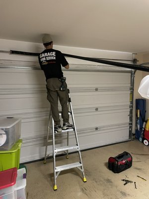 Garage door repair Austin. - This job was an emergency call the spring on the garage door was broken and the garage door opener / motor out of alignment.
