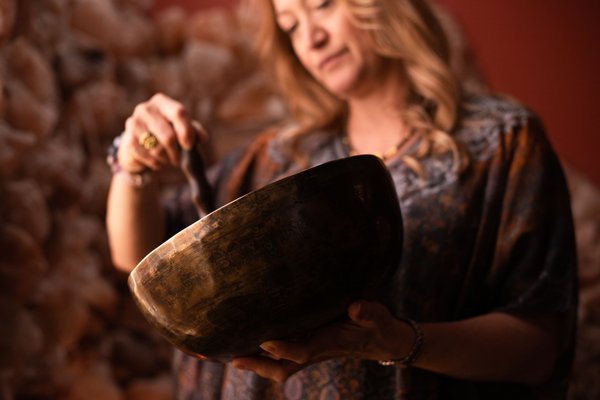 Singing Bowl Sound Healing - Singing Bowl Sound Healing – 30 minutes $60.00
Sound is all around us, and inside of us. Sound healing uses vibrations to help you reach a meditative frequency.
We respond to sound as early as 5 months in our mother’s bellies. Most likely, we’ve all weeped or rejoiced to the voices and instruments of our favorite artists, but what many don’t know is the powerful healing property of sound vibrations. Sound healing is an ancient meditative practice that uses different musical implements to create healing vibrations around the body in a meditative state. Singing Bowls are tuned at strategic frequencies for healing different parts of the body and mind. This method of sound healing is ancient and sacred in Tibet, where it was first used around the 12th century for meditation and rituals. Other types of Sound Therapy, like vibro-acoustic, guided meditation and neurological music therapy combine frequency and mindfulness therapy to treat conditions like anxiety and depression.