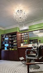 We will make you look awesome - From the moment you step into The Midtown Shave shop, you sense the immediate atmosphere of a gentleman’s grooming oasis in the middle of the Concrete Jungle, where life’s stresses are left behind the entrance door and replaced with a friendly atmosphere and a personal approach. A thoughtfully designed interior, antique chairs, friendly and welcoming barbers, steaming hot towels, soothing sounds of music, and carefully picked lines of high-quality products that add to the ambiance elevating your grooming getaway experience to the next level. You are greeted as royalty with a choice of available beverages. After the initial consultation with one of our experienced barbers, you are in for an unforgettable treat. 

Your barber chair is waiting for you. So, sit back, relax, and enjoy.
