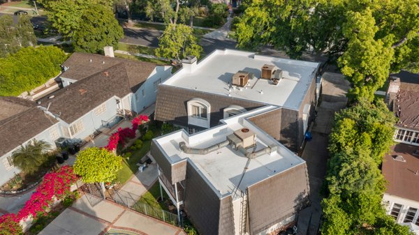 TPO Residential Roof Installation - San Marino Project - We converted this gravel and asphalt roof to TPO in Whittier, Los Angeles. TPO roofing emerges as the optimal choice for flat roofs, surpassing gravel and asphalt alternatives in a myriad of ways. Its remarkable durability, proven longevity, and resistance to the elements set it apart, while its energy-efficient reflective surface reduces cooling costs and environmental impact. TPO's streamlined installation process and minimal maintenance needs outshine traditional options, underlined by its eco-friendly composition and recyclability. With customizable aesthetics that harmonize with any architectural style, TPO roofing stands as the ultimate solution that redefines flat roofing standards, offering an unparalleled blend of performance, sustainability, and visual appeal. At Factor Roofing we follow the manufacturer's standards when it comes to installation and will offer the highest warranty on the market to our customers. TPO Residential Roof Installation - San Marino Project - We converted this gravel and asphalt roof to TPO in Whittier, Los Angeles. TPO roofing emerges as the optimal choice for flat roofs, surpassing gravel and asphalt alternatives in a myriad of ways. Its remarkable durability, proven longevity, and resistance to the elements set it apart, while its energy-efficient reflective surface reduces cooling costs and environmental impact. TPO's streamlined installation process and minimal maintenance needs outshine traditional options, underlined by its eco-friendly composition and recyclability. With customizable aesthetics that harmonize with any architectural style, TPO roofing stands as the ultimate solution that redefines flat roofing standards, offering an unparalleled blend of performance, sustainability, and visual appeal. At Factor Roofing we follow the manufacturer's standards when it comes to installation and will offer the highest warranty on the market to our customers.