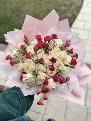25 count rose bouquet - 24 count Ecuadorian rose bouquet with red & hot pink mini carnation and wax flower filler.