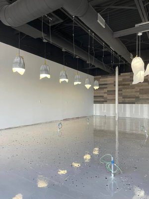Project Spotlight: 2,500 Sq. Ft. Nail Salon Floor Remodel - Garage Armor CT completed a stunning epoxy floor installation for a brand-new 2,500 sq. ft. nail salon. The client wanted a clean, modern, and highly durable surface that would not only elevate the look of the space but also stand up to daily salon traffic and chemicals.

We installed a light gray epoxy base with black and white flake, topped with a high-gloss, industrial-grade topcoat for maximum protection and shine. The result is a flawless, mirror-like finish that reflects light beautifully, adds visual space, and provides an easy-to-clean surface perfect for a busy beauty environment.

From prep to polish, this floor was professionally completed with attention to detail, ensuring a long-lasting, low-maintenance solution that complements the salon’s modern décor.