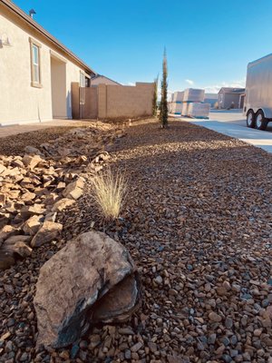 Front Yard Landscape Install - This was a new construction home with no landscape installed. We came in, installed plants and irrigation system. Created rip rap rock drainage, placed boulders and spread rock for finished front yard. Front Yard Landscape Install - This was a new construction home with no landscape installed. We came in, installed plants and irrigation system. Created rip rap rock drainage, placed boulders and spread rock for finished front yard.