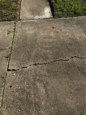 Pool of water on concrete - On this repair customer call us cuz they have a bad cracked concrete we saw the curb was damaged to and decided to repair it with out asking the customer they was pretty have after the end result
