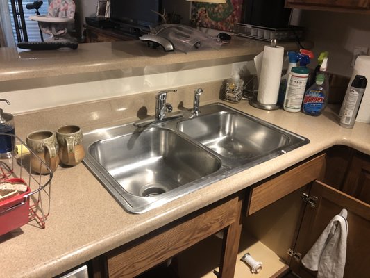 Kitchen sink replacement - Home owner supplied new kitchen sink and faucet. Carefully removed existing sink and installed new sink with single hole and disposal. Installed new drains and supply lines.