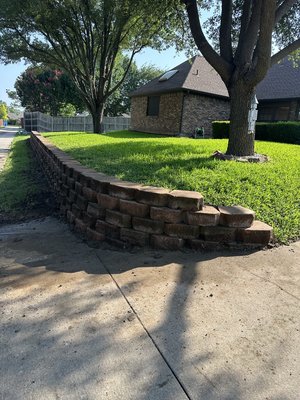 Retaining wall reconstruction - This clients retaining wall was leaning, close to falling so we completely took it down & rebuilt it using the same pavers. Retaining wall reconstruction - This clients retaining wall was leaning, close to falling so we completely took it down & rebuilt it using the same pavers.