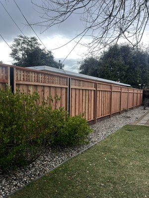 Albert Project - This brand new fence we built here was installed using metal posts. We welded the top of the metal post so it was completely sealed and no water went through in the future. We set the posts with mixed concrete and let it sit one entire day. Then we came back and attached 2x4 redwood con common rails next to the metal posts to begin the framing from there. We used redwood con common fence boards, top rails, 1x1 trims, and square triple lattice. We also used pressure treated 2x8 kickboards and bottom 2x4 rails. Albert Project - This brand new fence we built here was installed using metal posts. We welded the top of the metal post so it was completely sealed and no water went through in the future. We set the posts with mixed concrete and let it sit one entire day. Then we came back and attached 2x4 redwood con common rails next to the metal posts to begin the framing from there. We used redwood con common fence boards, top rails, 1x1 trims, and square triple lattice. We also used pressure treated 2x8 kickboards and bottom 2x4 rails.
