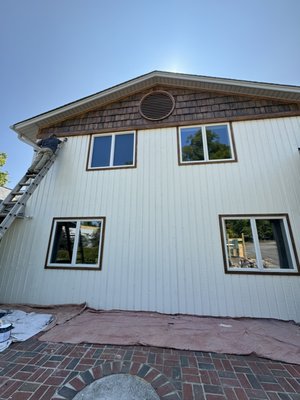 Lake House Exterior Painting - This renovation was done on the exterior of a lake-house. We stained the wood, and painted the exterior of the house white and also a new addition to the house. Lake House Exterior Painting - This renovation was done on the exterior of a lake-house. We stained the wood, and painted the exterior of the house white and also a new addition to the house.