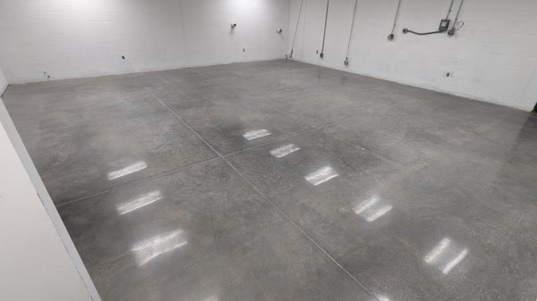 Commercial Floor Remodel - Donaldson center - We recently completed a 3000 sq ft commercial building project where we polished the concrete floors to perfection - you can see your reflection in them! Our team started by removing old tile flooring and any adhesive that was left over. We then cleaned the surface with a degreasing agent due to a large amount of chemical staining. Once the floor was prepped, we began grinding the surface to remove any imperfections, then honed and densified the concrete to prepare it for the polishing process. We used our expertise to apply multiple levels of polishing, resulting in a smooth and glossy finish that brought the floors to life. To protect the newly polished floors, we applied a guard down solution. Not only will this protect the newly polsihed concrete, but it will prevent any checmicals from staining the floor for up to 24 hours! The results were outstanding, and the client was thrilled with the final outcome. Contact us today to learn how we can transform your concrete floors to meet your unique needs and preferences. Commercial Floor Remodel - Donaldson center - We recently completed a 3000 sq ft commercial building project where we polished the concrete floors to perfection - you can see your reflection in them! Our team started by removing old tile flooring and any adhesive that was left over. We then cleaned the surface with a degreasing agent due to a large amount of chemical staining. Once the floor was prepped, we began grinding the surface to remove any imperfections, then honed and densified the concrete to prepare it for the polishing process. We used our expertise to apply multiple levels of polishing, resulting in a smooth and glossy finish that brought the floors to life. To protect the newly polished floors, we applied a guard down solution. Not only will this protect the newly polsihed concrete, but it will prevent any checmicals from staining the floor for up to 24 hours! The results were outstanding, and the client was thrilled with the final outcome. Contact us today to learn how we can transform your concrete floors to meet your unique needs and preferences.