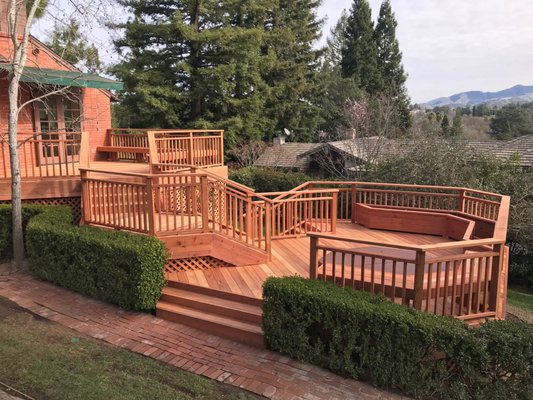 Stunning Multi Level Redwood Deck - We had the pleasure of replacing an existing redwood deck in the Alamo area. This Heart B Redwood Deck is truly a show stopper. It features 3 levels of usable area connected with short stair cases, traditional custom built wood railing, and redwood lattice skirting. There was an existing hot tub we needed to craft the deck around. We also added built in bench seating around the recessed hot tub and a built in planter box. We built the deck into the existing mature landscaping giving the deck a polished and finished look. We are truly honored to have been part of such a stunning project! Stunning Multi Level Redwood Deck - We had the pleasure of replacing an existing redwood deck in the Alamo area. This Heart B Redwood Deck is truly a show stopper. It features 3 levels of usable area connected with short stair cases, traditional custom built wood railing, and redwood lattice skirting. There was an existing hot tub we needed to craft the deck around. We also added built in bench seating around the recessed hot tub and a built in planter box. We built the deck into the existing mature landscaping giving the deck a polished and finished look. We are truly honored to have been part of such a stunning project!