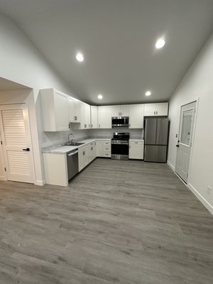 Full Kitchen remodel - This house previously had a bad layout. We fully demolished the entire space and came up with a new layout for the house in order to give a more inviting space and higher ceilings. The project consisted of vaulting the ceiling, renovating the layout, converting the house to gas, new electrical, Plumbing, cabinets, and appliances.